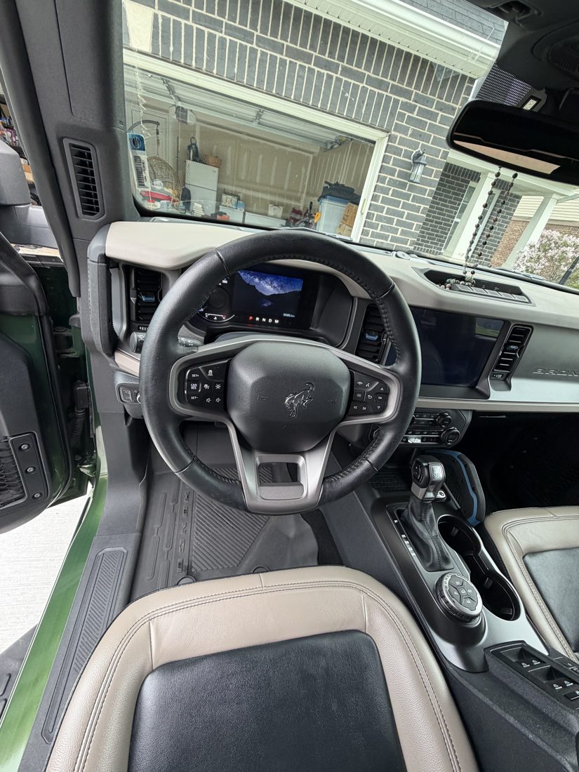 Detailed steering wheel, dash and console of a Ford Bronco
