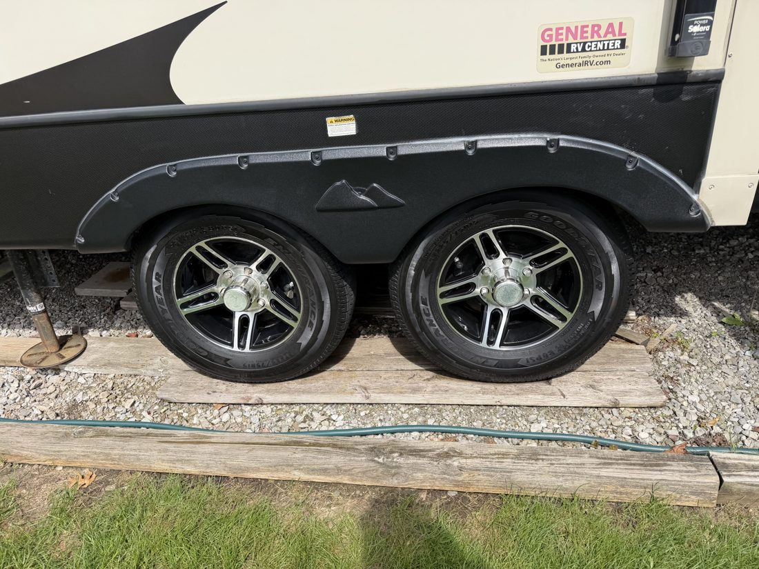 Travel trailer wheels and tires cleaned and dressed
